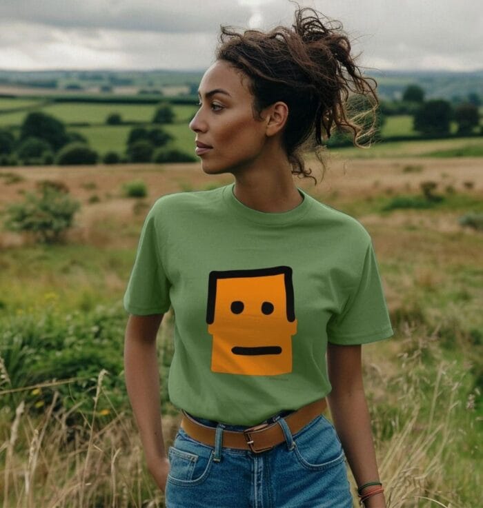 A woman wears the Terribleist, Terry Blism Logo T.Shirt in a sickly green type colour