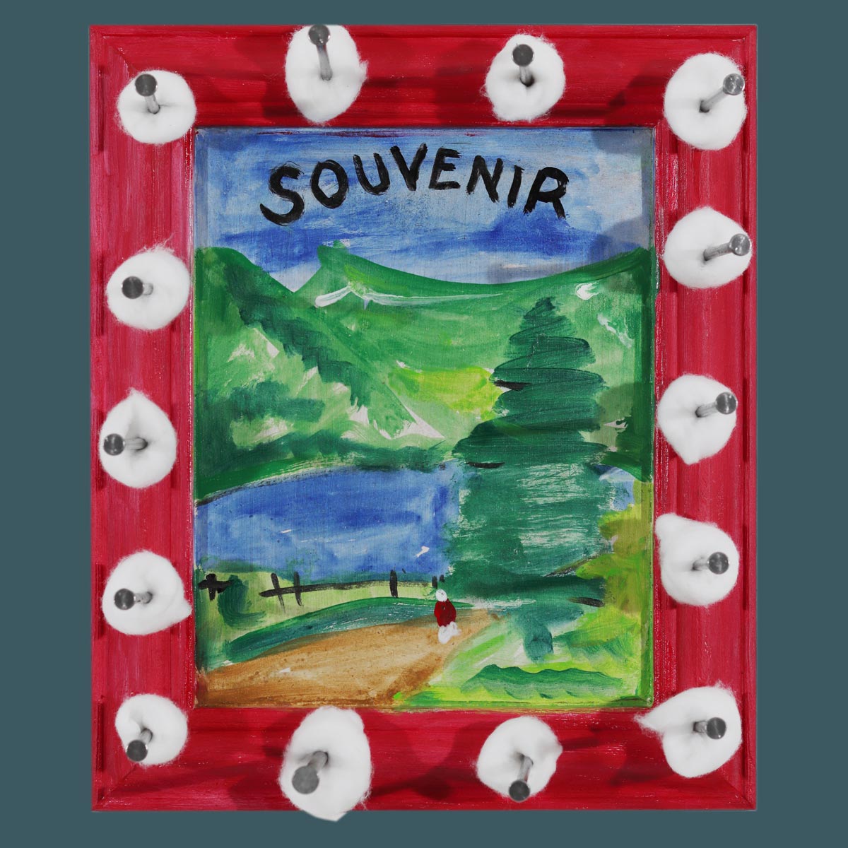 A Terribleist artwork by Jack Myntan featuring a red wooden frame containing a deliberately naive painting of a pastoral landscape with rolling green hills, trees, and the word "SOUVENIR" written in black letters across a blue sky. White cotton wool balls are violently attached around the frame's perimeter with large industrial nails, exemplifying the Terribleist movement's embrace of bad art, anti-perfectionism, and purposeful artistic failure.